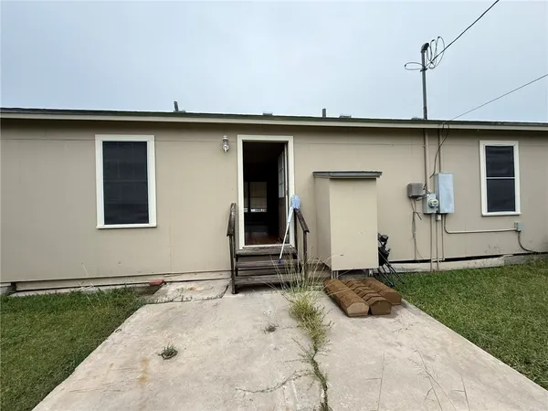 a view of a front of a house with a yard