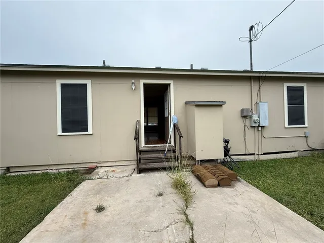 a view of a front of a house with a yard