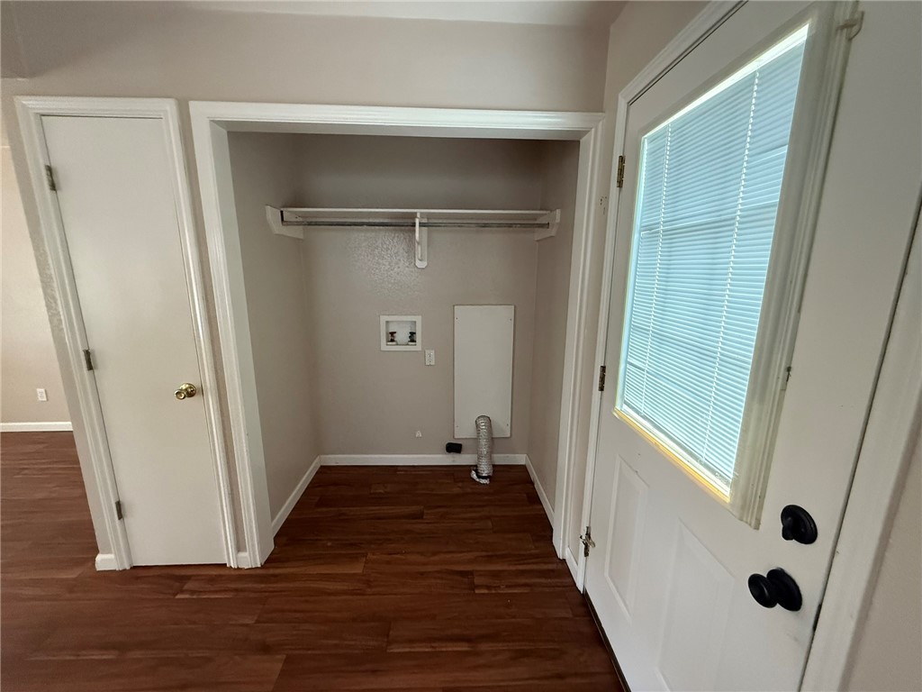 308 East 2nd Street Bishop, TX 78343 - Photo 5 of 12 a view of a hallway with wooden floor and closet