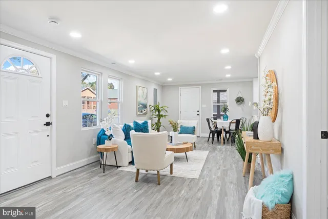 a view of a dining room with furniture and wooden floor