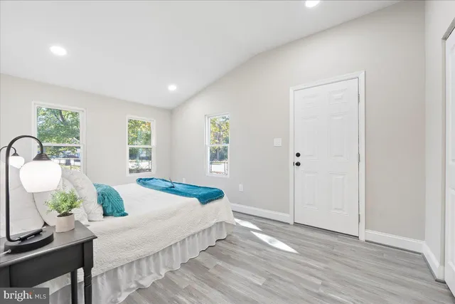 a bedroom with a bed and a table