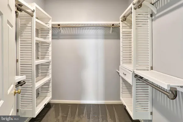a bathroom with a tub a sink and a shower