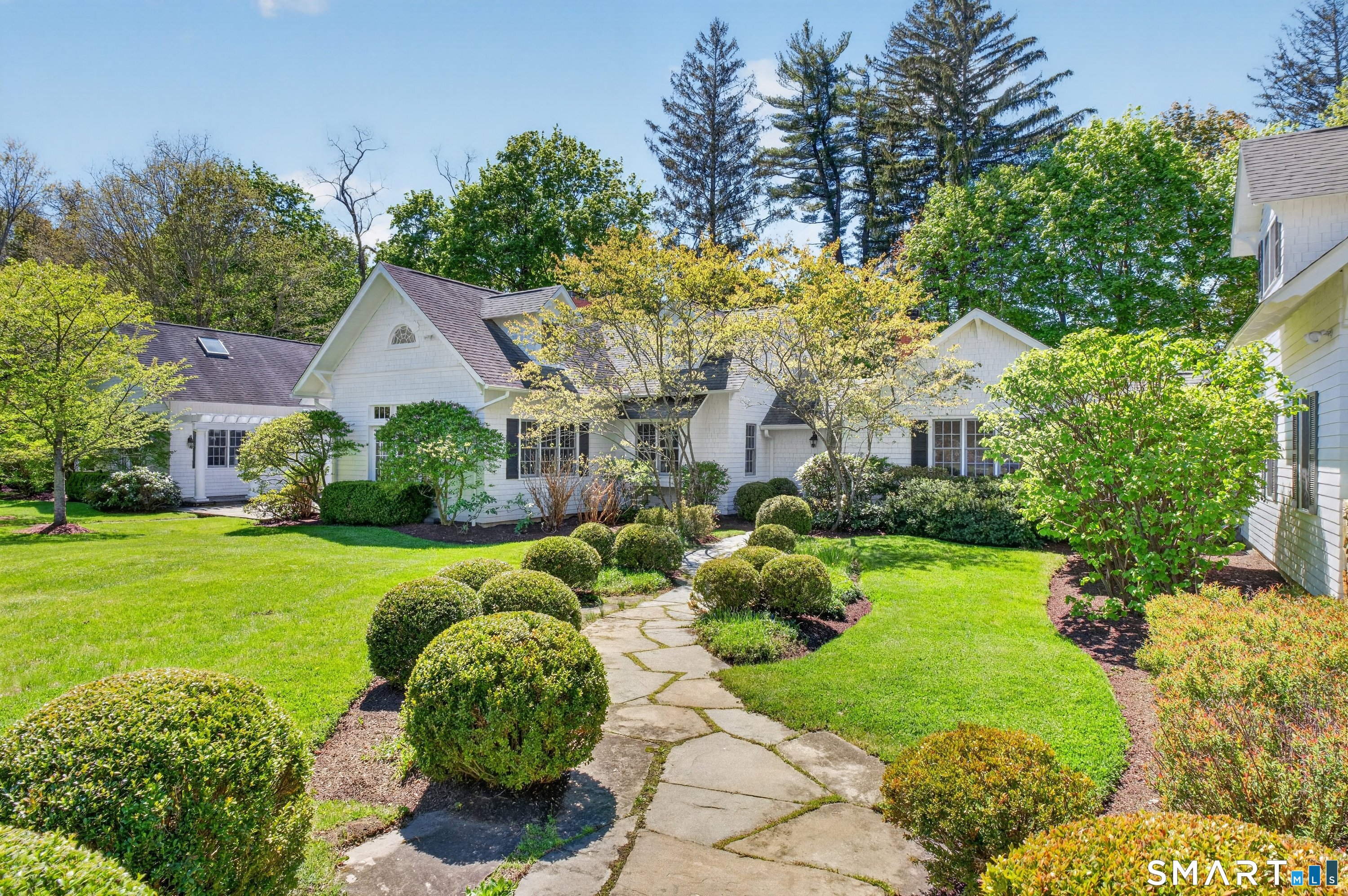 41 Peaceable Street Ridgefield, CT 06877 - Photo 39 of 40 a view of a house with a garden