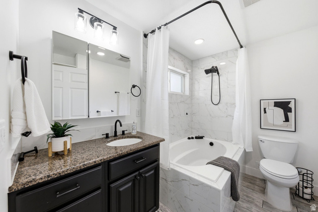 120 North 1230 E Street Springville, UT 84663 - Photo 19 of 60 Bathroom featuring a dark wood-finish vanity with a speckled countertop, undermount sink, and black fixtures