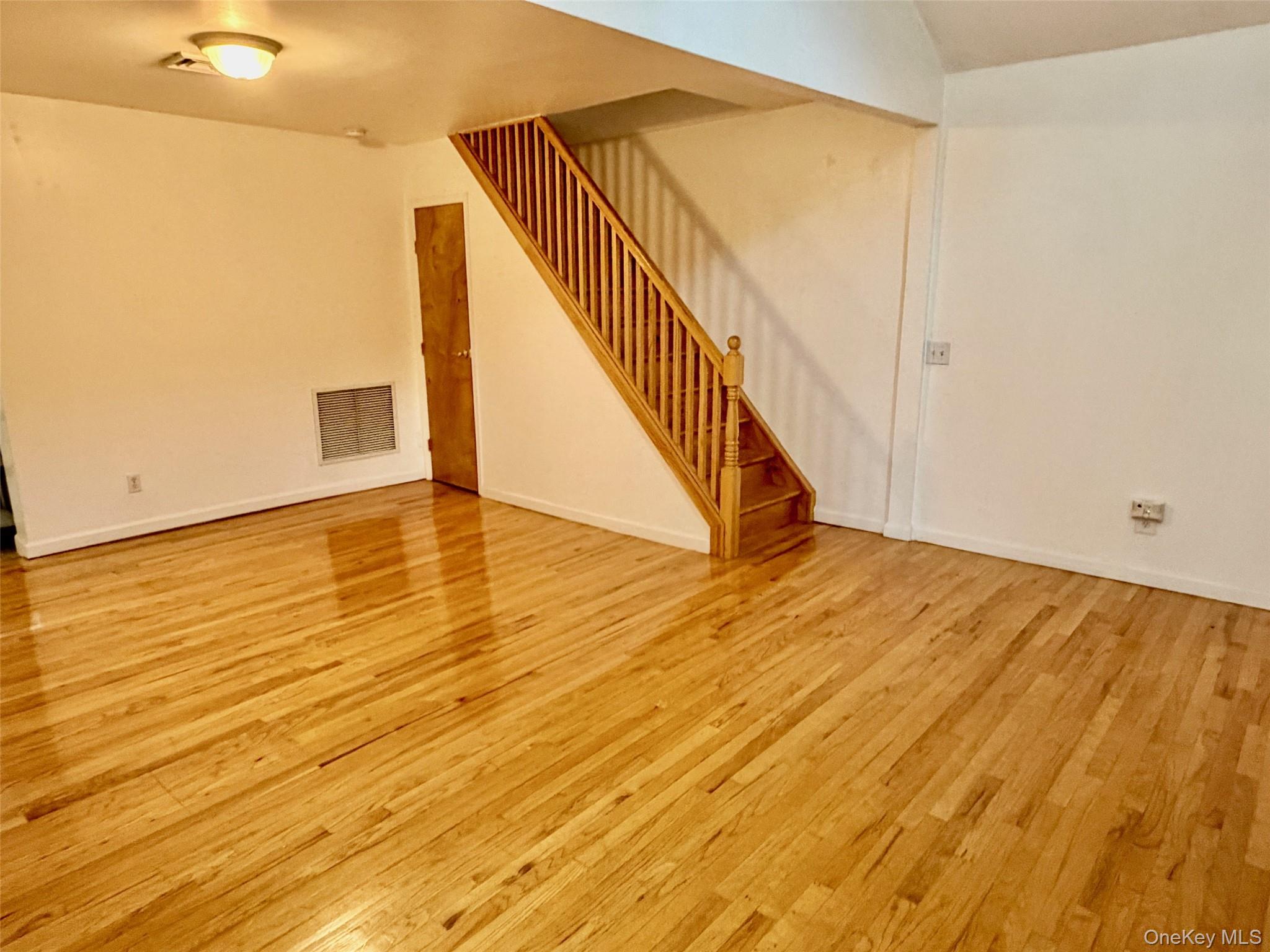 16 November Walk Long Beach, NY 11561 - Photo 3 of 11 a view of an entryway with wooden floor