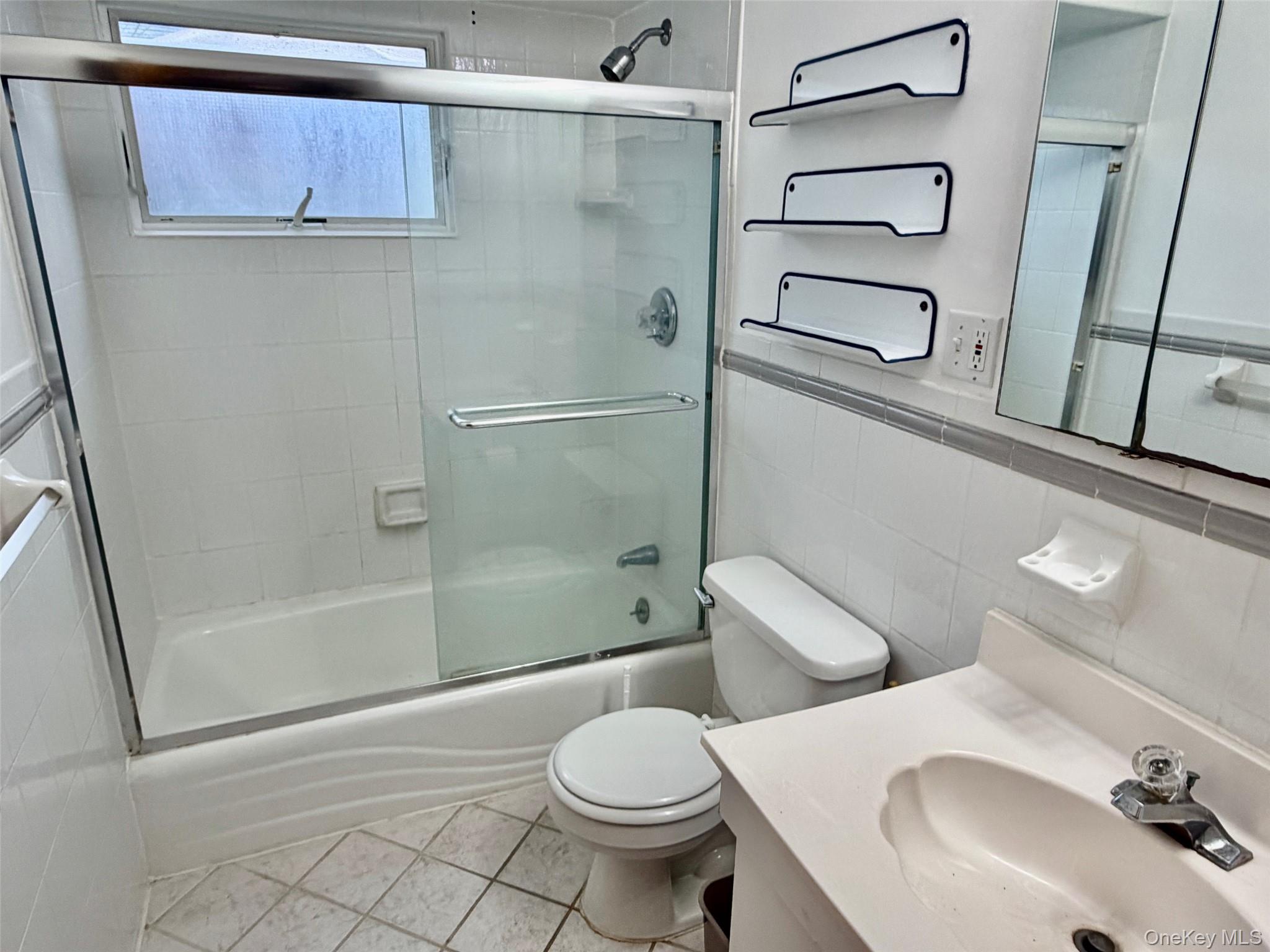 16 November Walk Long Beach, NY 11561 - Photo 8 of 11 a bathroom with a sink toilet and shower