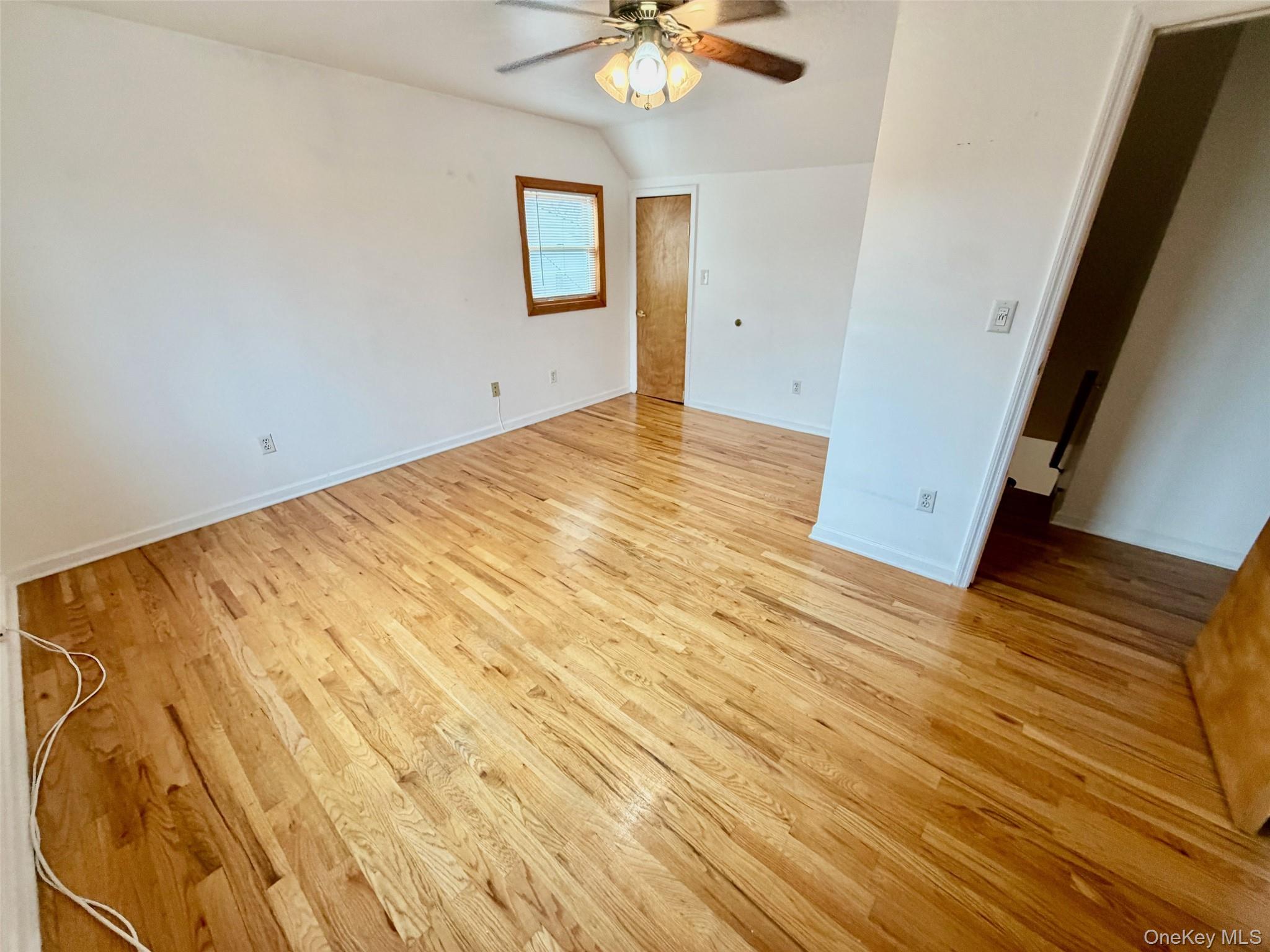16 November Walk Long Beach, NY 11561 - Photo 9 of 11 a view of a room with wooden floor and a ceiling fan