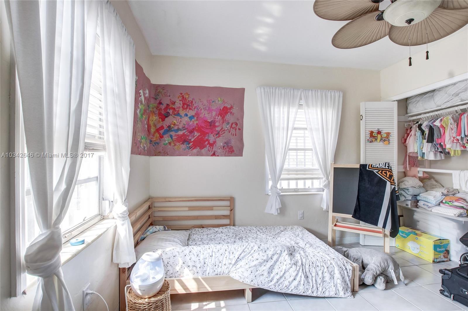 4300 Southwest 3rd Street Miami, FL 33134 - Photo 12 of 21 a bedroom with a bed and furniture with the outer view