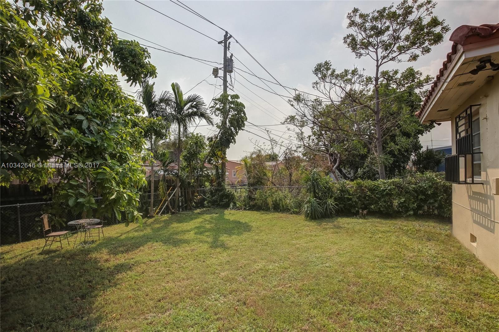 4300 Southwest 3rd Street Miami, FL 33134 - Photo 16 of 21 a backyard of a house with lots of green space