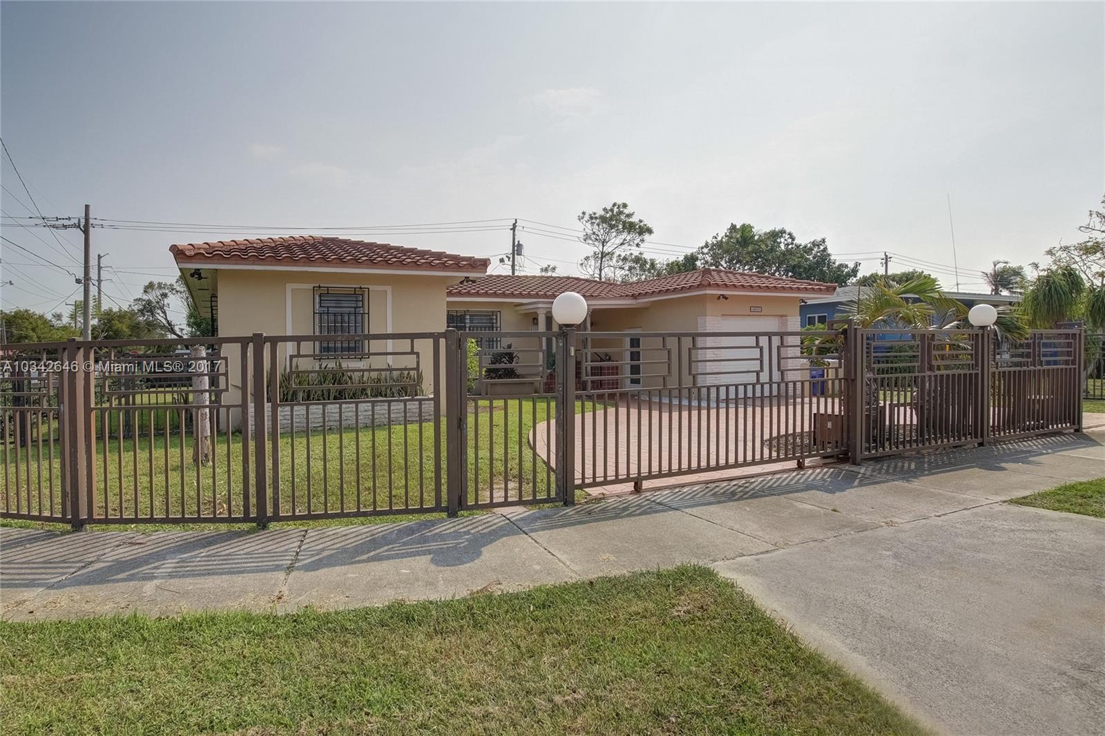 4300 Southwest 3rd Street Miami, FL 33134 - Photo 4 of 21 a view of a house with a wooden deck and a yard