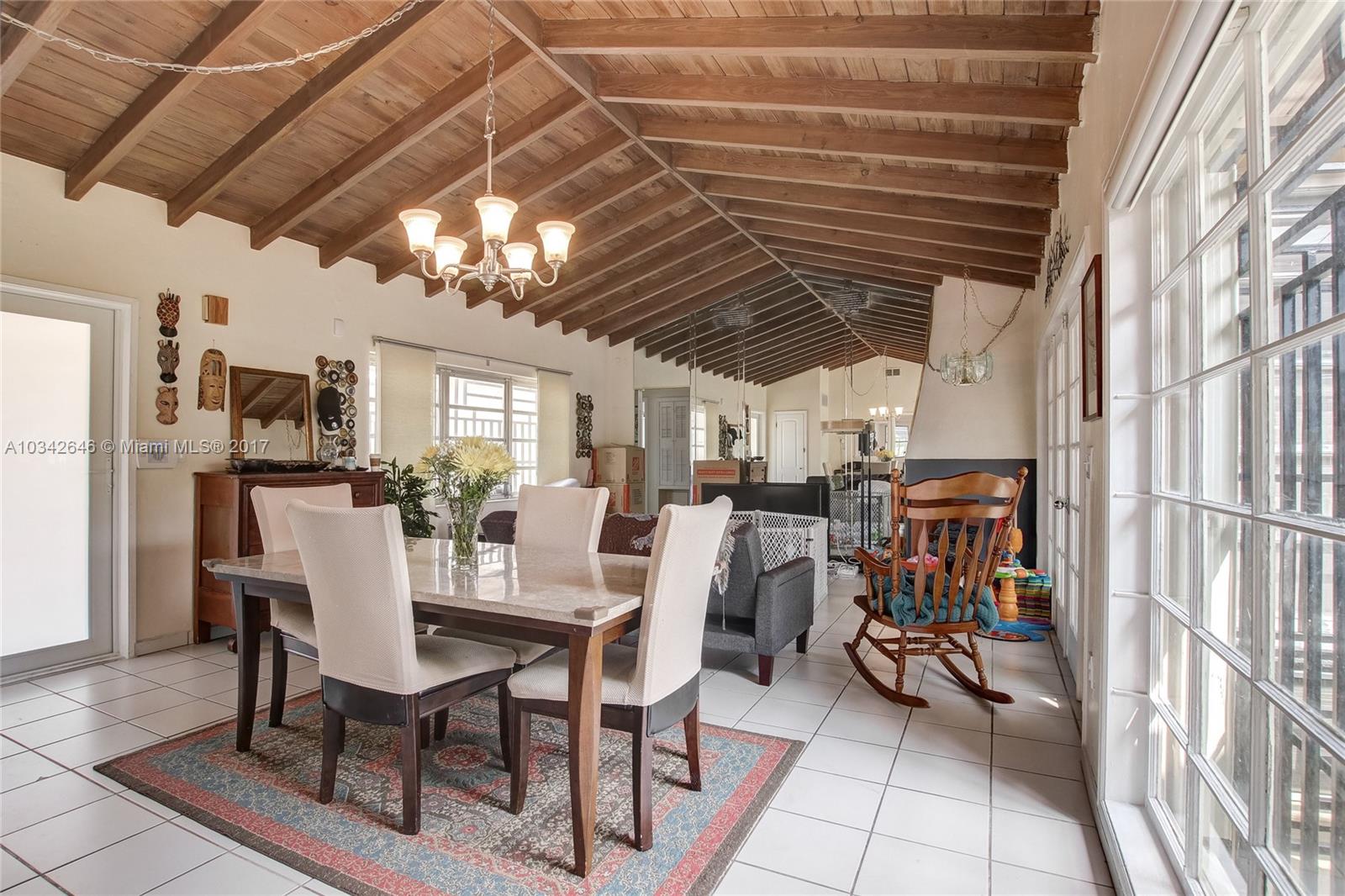 4300 Southwest 3rd Street Miami, FL 33134 - Photo 8 of 21 a view of a dining room with furniture window and outside view