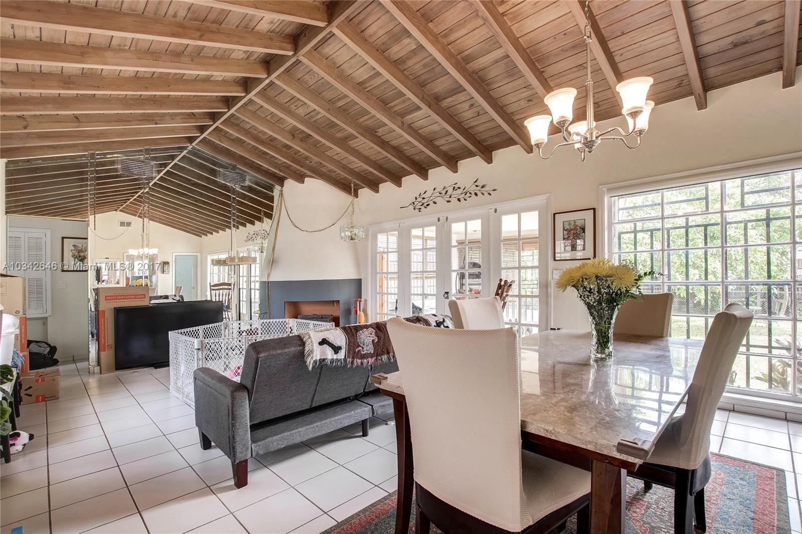 4300 Southwest 3rd Street Miami, FL 33134 - Photo 9 of 21 a view of a dining room with furniture window and outside view