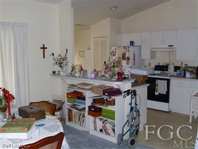 7286 Buchanan Road Fort Myers, FL 33967 - Photo 6 of 9 a room with furniture a rug and gym equipment
