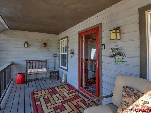 a living room with furniture and a rug