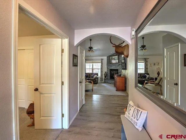 a view of a hallway view with living room and dining room view