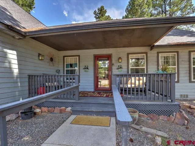 a front view of house with deck