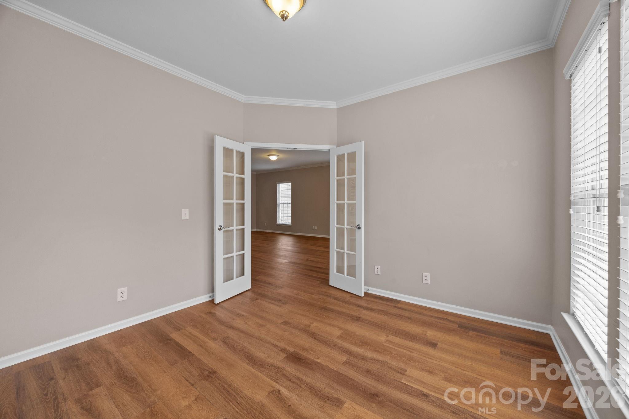 52062 Longspur Lane Fort Mill, SC 29707 - Photo 15 of 31 an empty room with wooden floor and windows