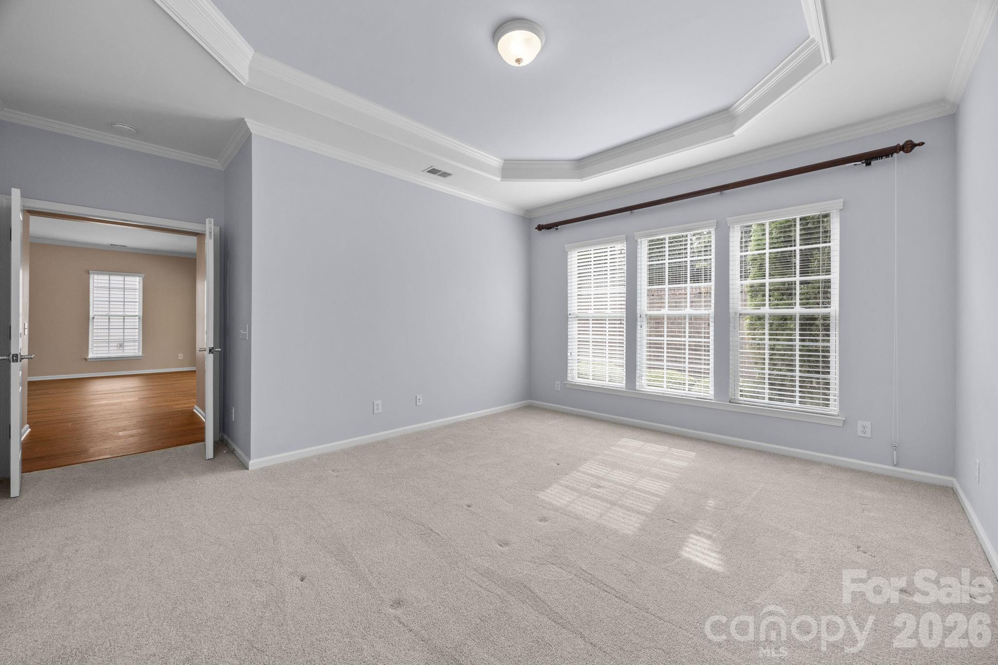 52062 Longspur Lane Fort Mill, SC 29707 - Photo 16 of 31 an empty room with chandelier fan and windows