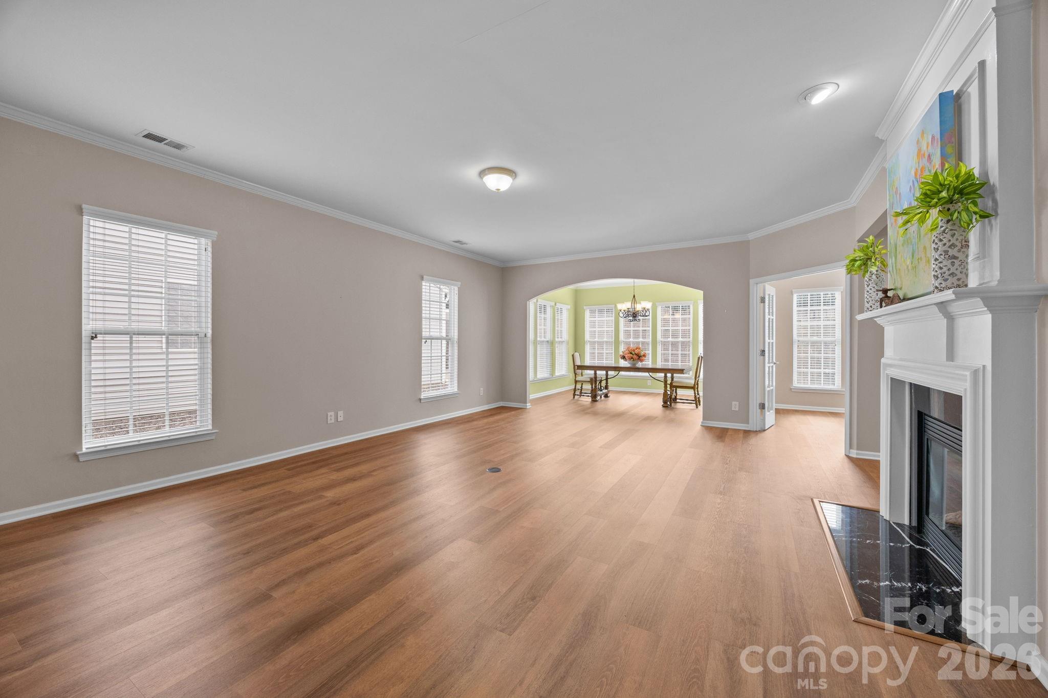 52062 Longspur Lane Fort Mill, SC 29707 - Photo 2 of 31 a view of empty room with fireplace and wooden floor