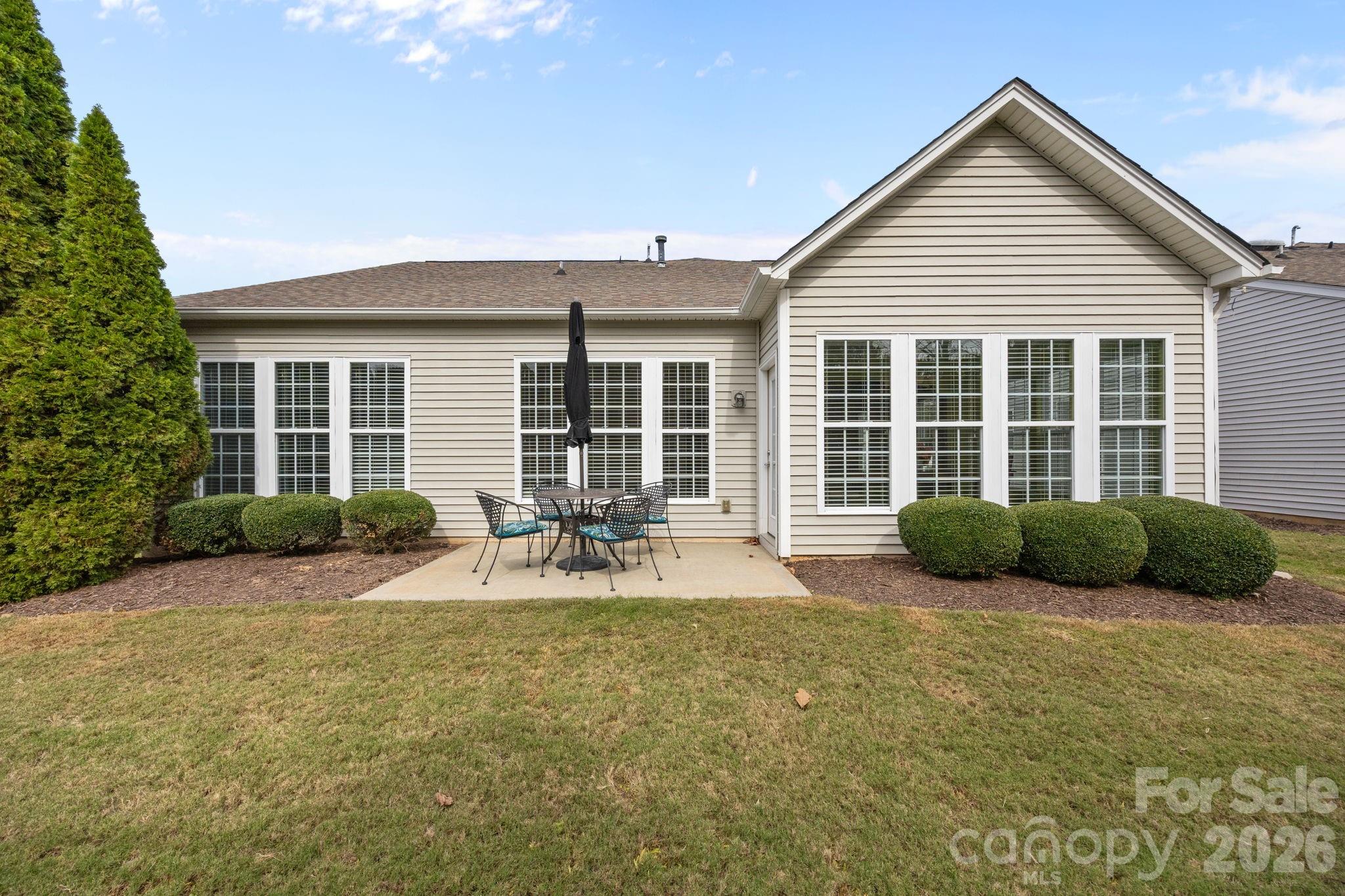 52062 Longspur Lane Fort Mill, SC 29707 - Photo 25 of 31 a view of a house with backyard and porch