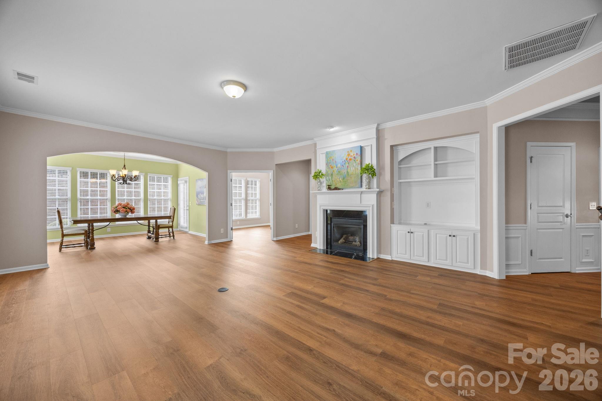 52062 Longspur Lane Fort Mill, SC 29707 - Photo 3 of 31 an empty room with wooden floor and fireplace