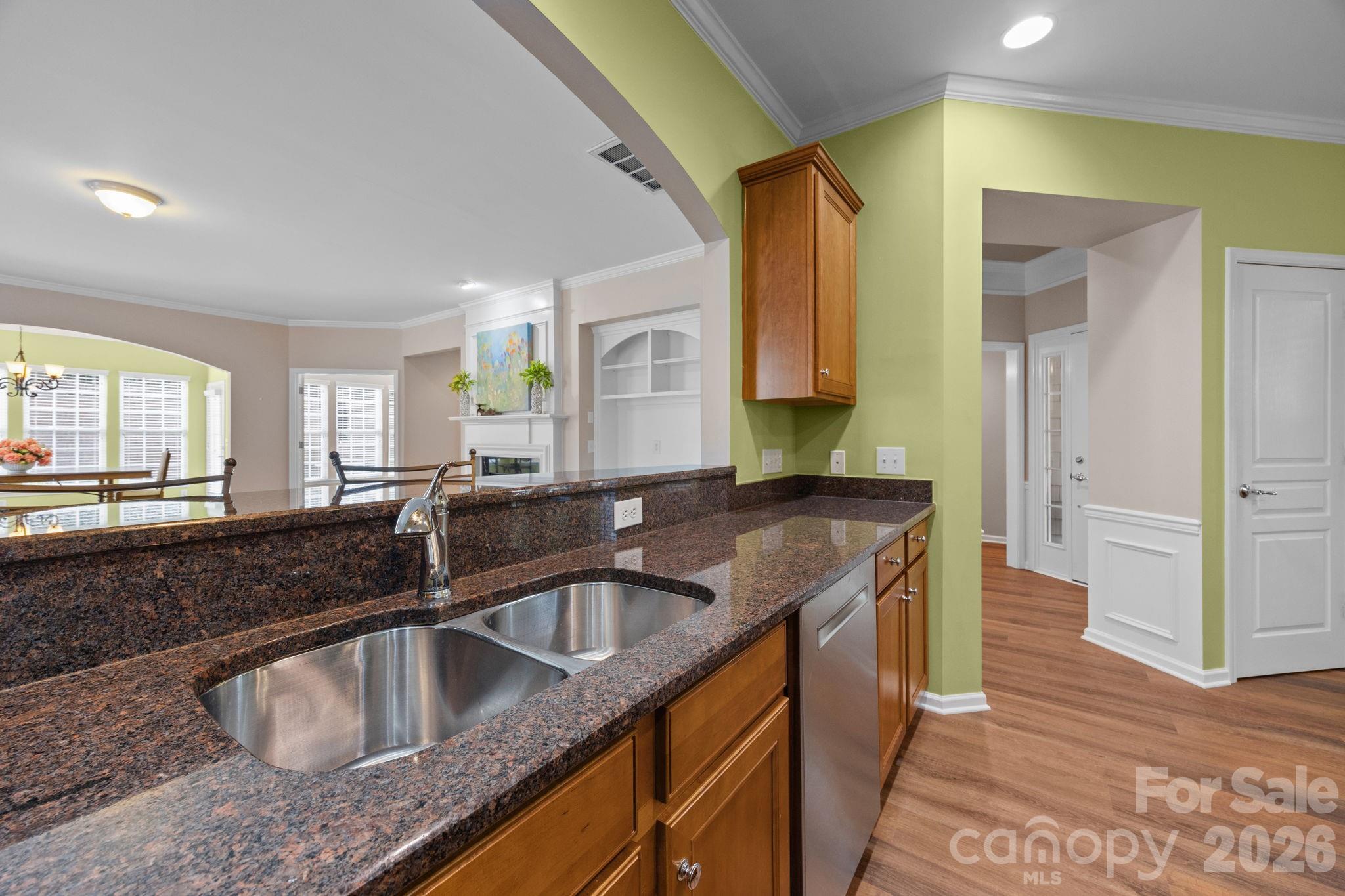 52062 Longspur Lane Fort Mill, SC 29707 - Photo 6 of 31 a kitchen with granite countertop a sink a counter top space and cabinets