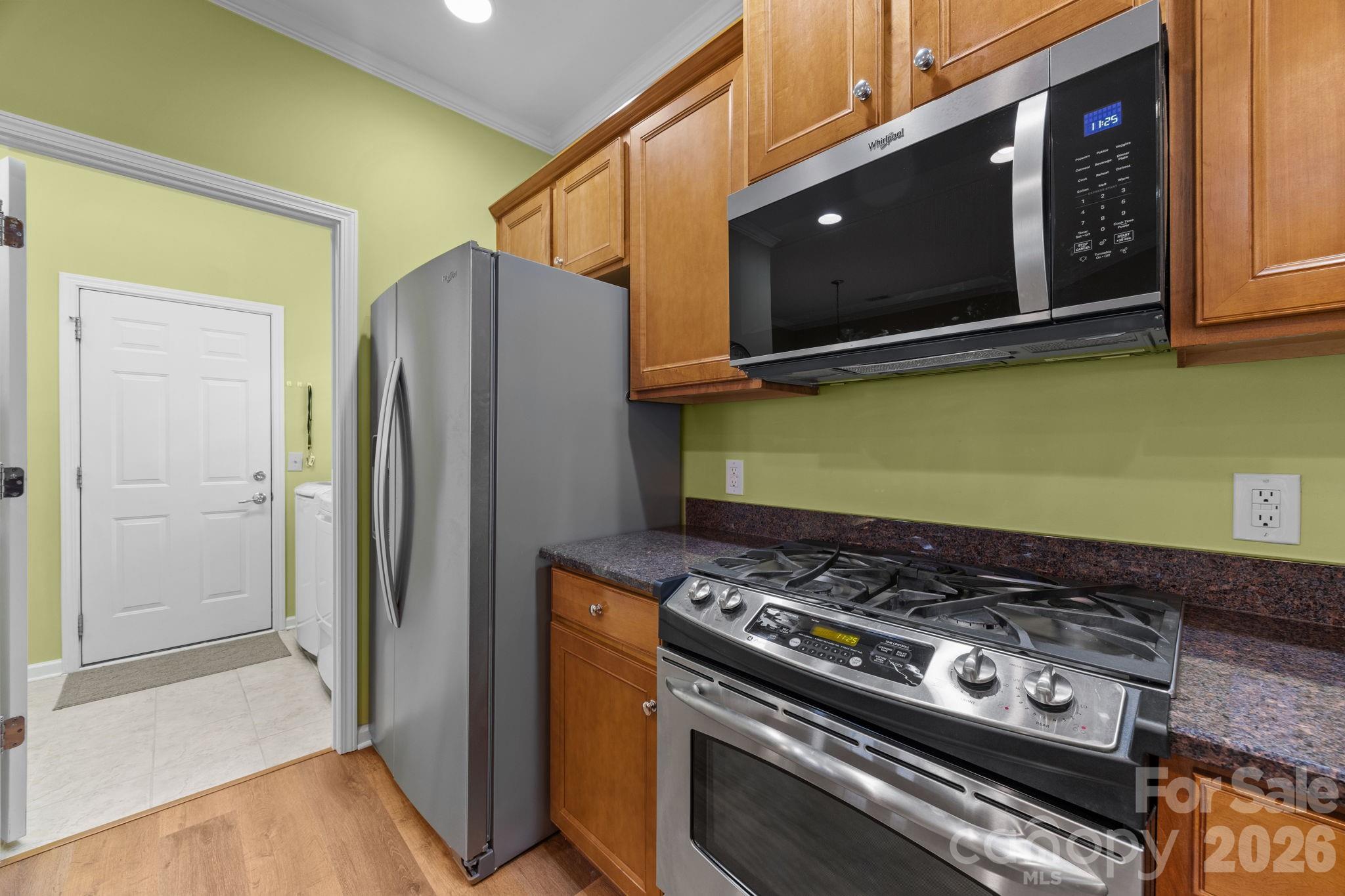 52062 Longspur Lane Fort Mill, SC 29707 - Photo 8 of 31 a kitchen with a stove and a microwave