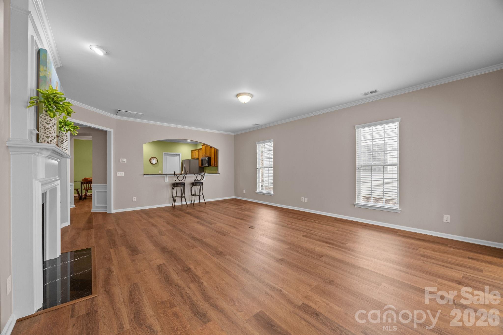 52062 Longspur Lane Fort Mill, SC 29707 - Photo 10 of 31 a view of empty room with wooden floor and fan