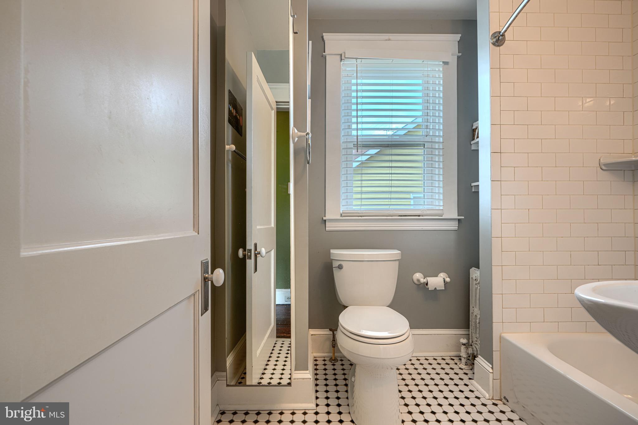 2705 Latona Road Baltimore, MD 21214 - Photo 43 of 53 a bathroom with a toilet and a shower