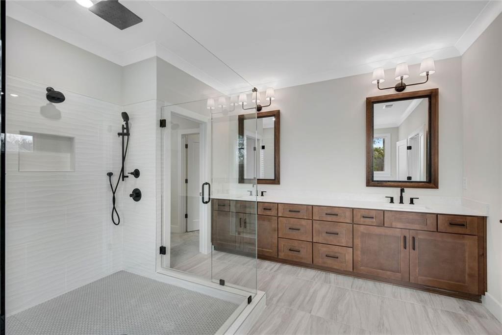 402 Manchester Lane Villa Rica, GA 30180 - Photo 27 of 63 a spacious bathroom with a tub sink and mirror