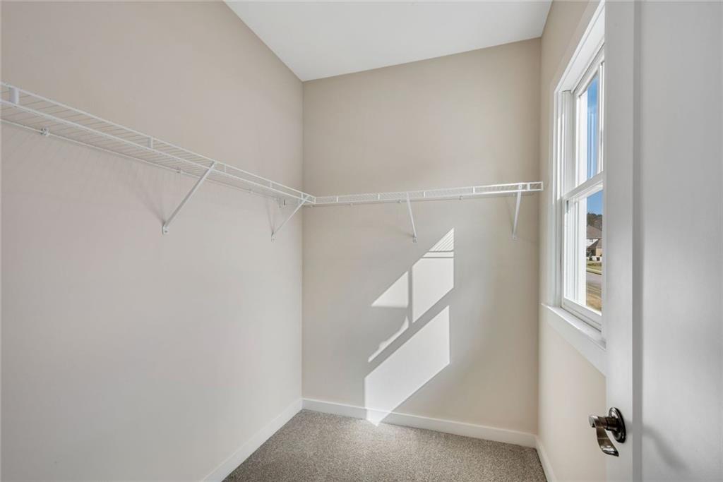 402 Manchester Lane Villa Rica, GA 30180 - Photo 34 of 63 a view of an empty walk in closet