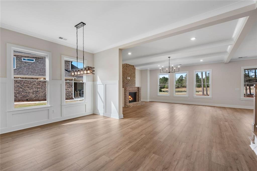402 Manchester Lane Villa Rica, GA 30180 - Photo 5 of 63 a view of an empty room with wooden floor and a window