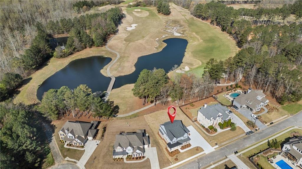 402 Manchester Lane Villa Rica, GA 30180 - Photo 51 of 63 an aerial view of a house with a yard and lake view