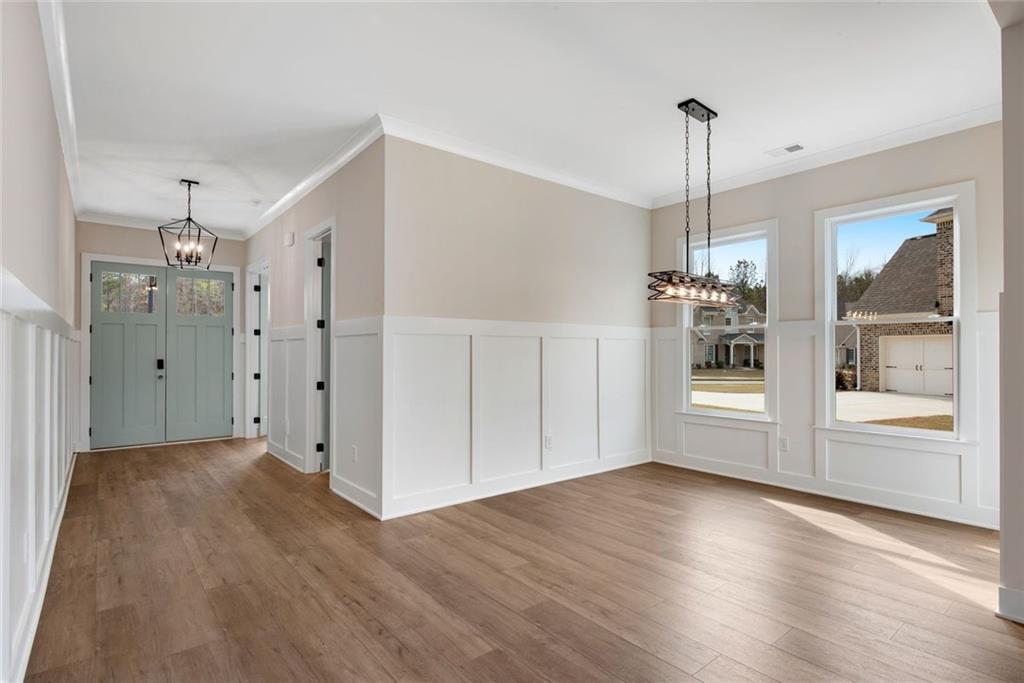 402 Manchester Lane Villa Rica, GA 30180 - Photo 6 of 63 a view of empty room with wooden floor and window