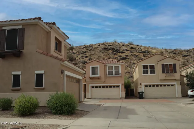 a view of residential houses with city view