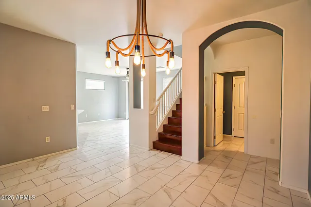 a view of entryway and hall with a front door