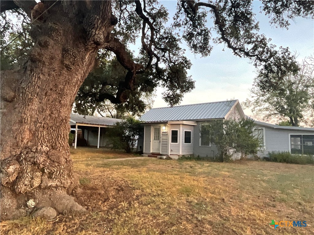 a house with trees in the background