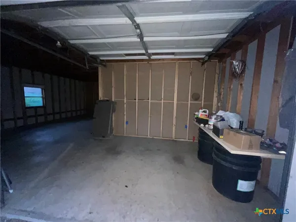 a view of a room with wooden walls