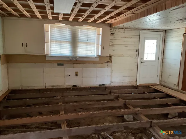 a bathroom with a sink a mirror and shower