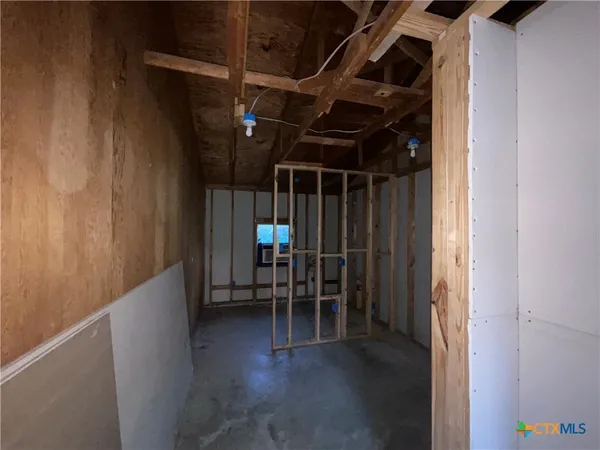 a view of a hallway with seating area