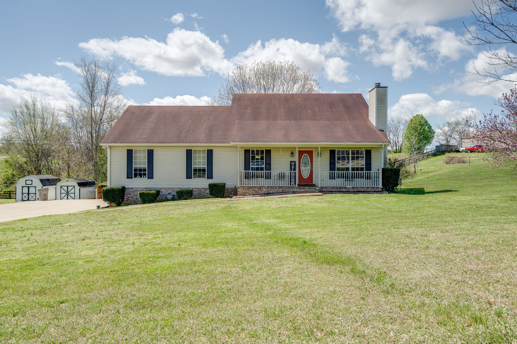 1011 Green Acres Road Joelton, TN 37080 - Photo 1 of 31 a front view of a house with a garden