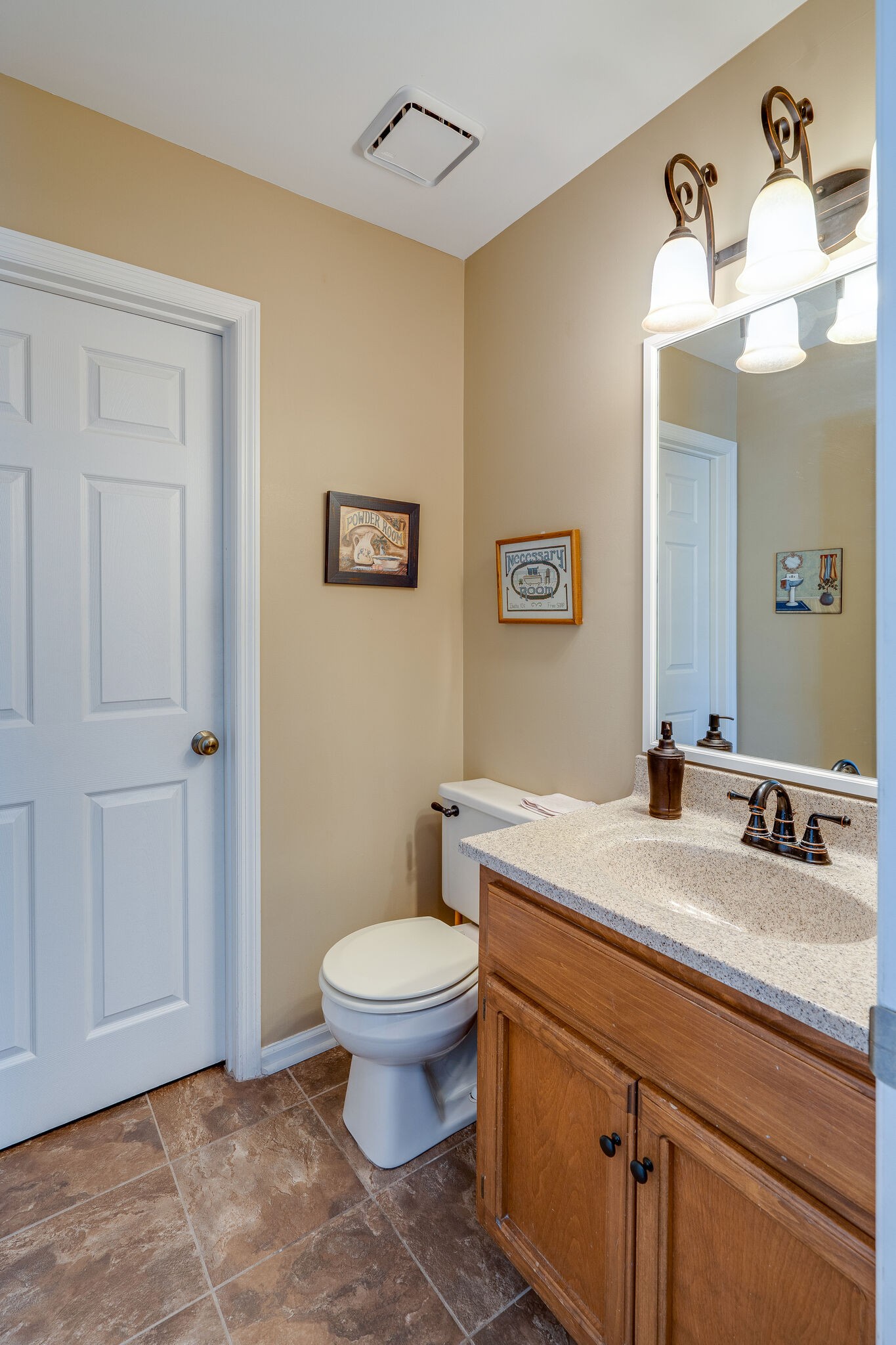 1011 Green Acres Road Joelton, TN 37080 - Photo 13 of 31 a bathroom with a granite countertop sink a toilet and mirror