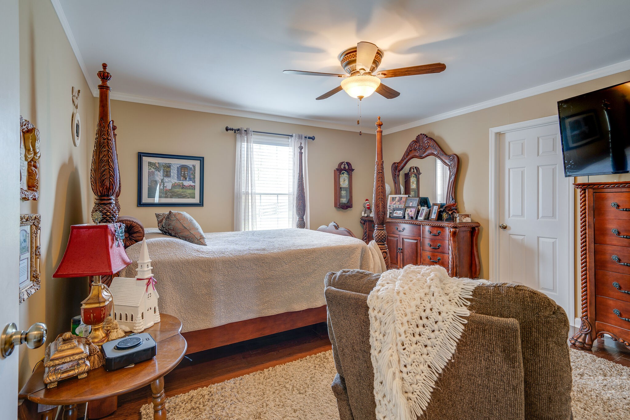 1011 Green Acres Road Joelton, TN 37080 - Photo 17 of 31 a bed room with a bed mirror and a chandelier