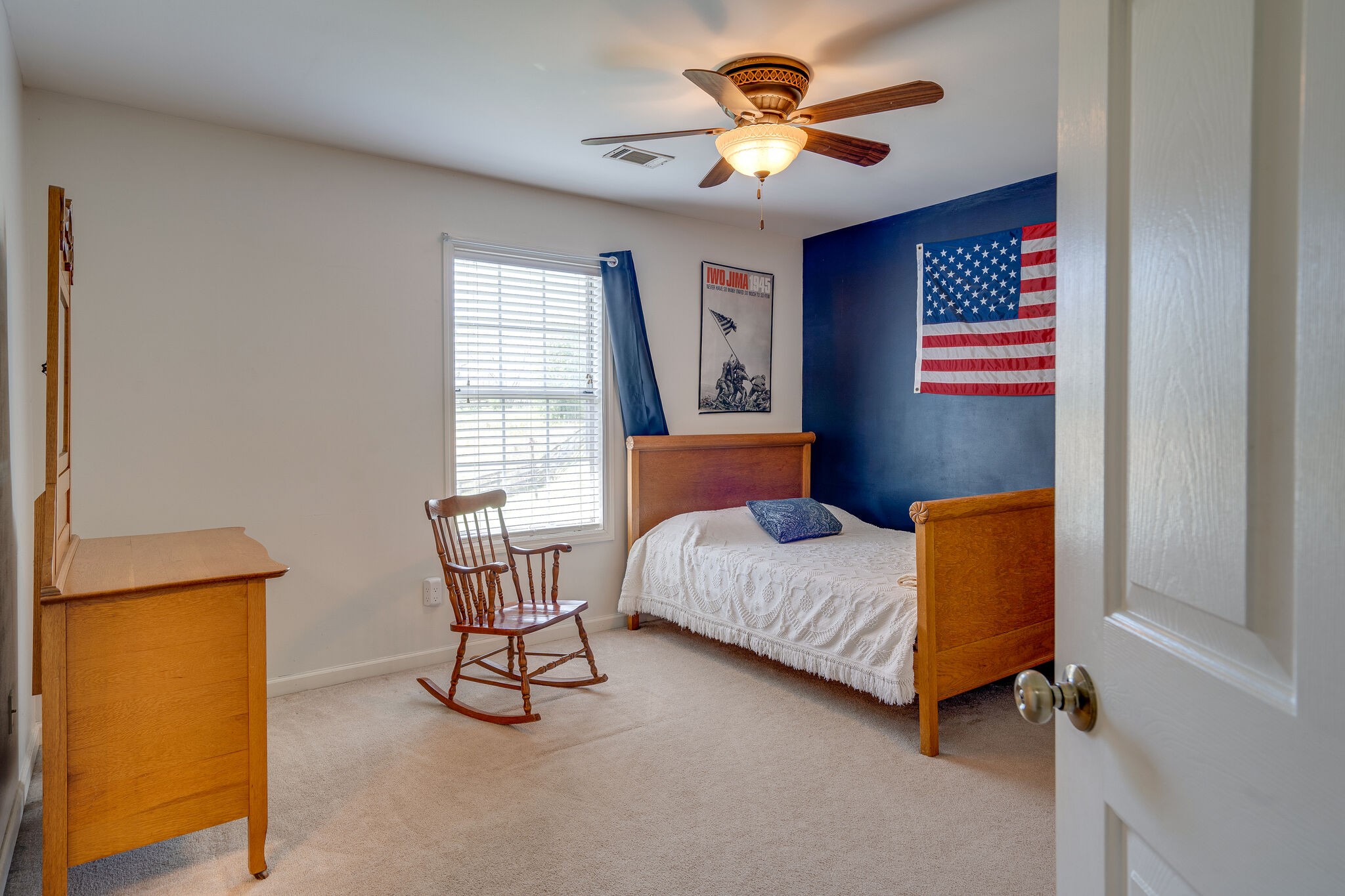1011 Green Acres Road Joelton, TN 37080 - Photo 20 of 31 a bedroom with a bed and a chandelier