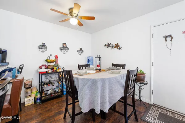 a view of a dining room with furniture and wooden floor