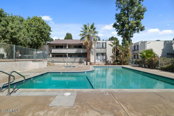 a view of a swimming pool with a patio
