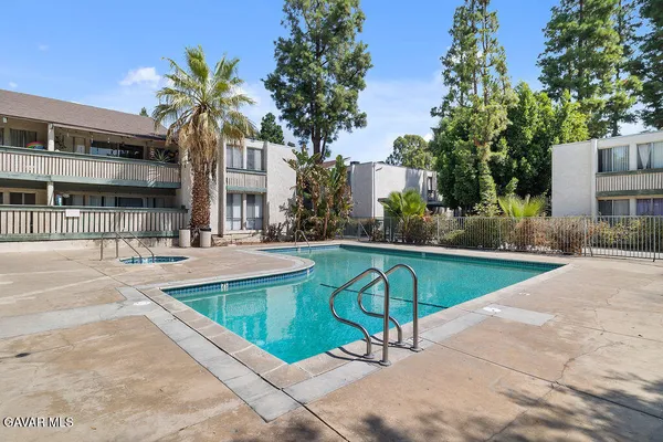 a view of a swimming pool with a patio