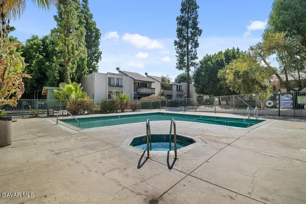 a table and chairs in a yard