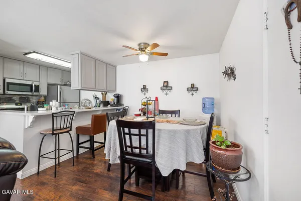 a view of a dining room with furniture and wooden floor