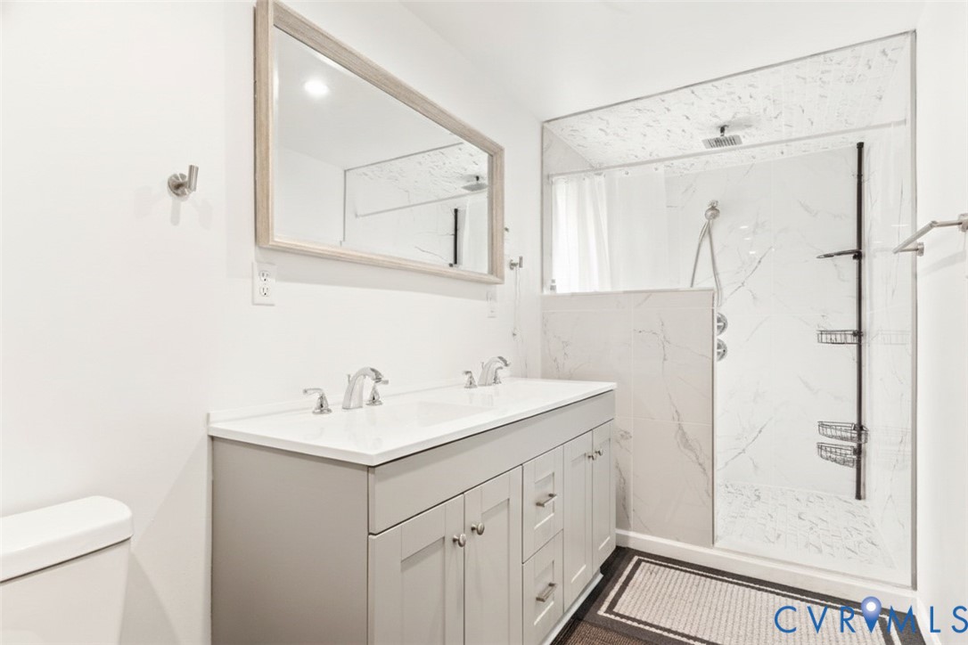 517 West Riverside Drive Lanexa, VA 23089 - Photo 17 of 27 a bathroom with a sink toilet and shower